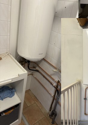Warmwateraccu in een betegelde ruimte
